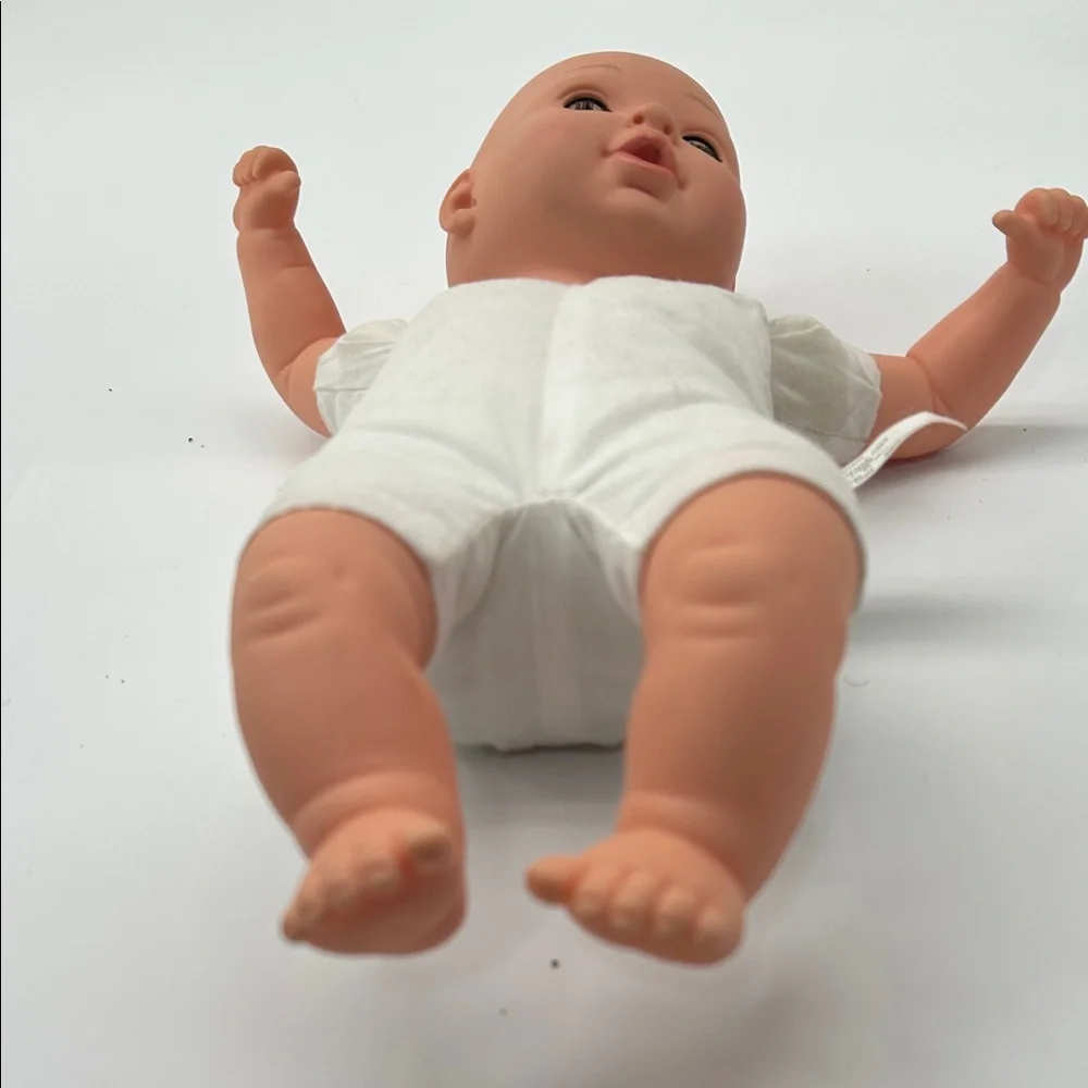 Realistic Baby Doll with White Outfit